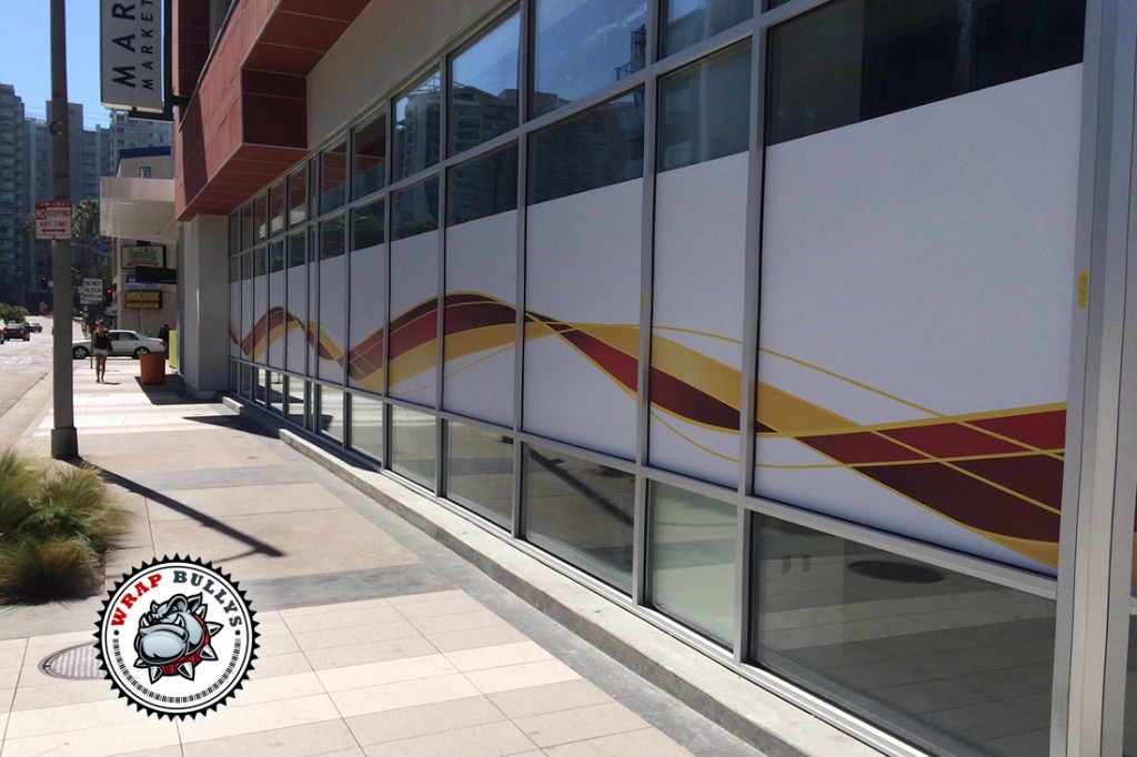 Wrap Bullys crew installing Wells Fargo branded window graphics on-site
