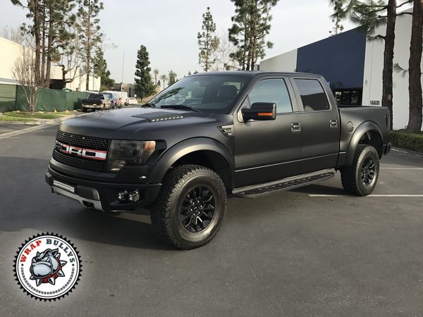 Dominant Stealth: Ford Raptor Unleashed with 3M Satin Black Truck Wrap