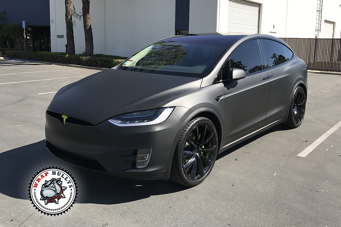 Tesla Model X wrapped in Matte Black Car Wrap. Call today for pricing.