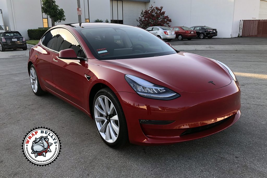 Tesla Model 3 protected with XPEL Ultimate Plus PPF, rear driver-side three-quarter view