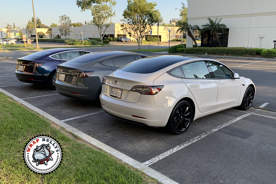 Trifecta of Style: Tesla Model 3 Trio Wrapped in 3M Gloss Storm Gray, Avery Gloss Dark Gray, and 3M Gloss Rising Sun