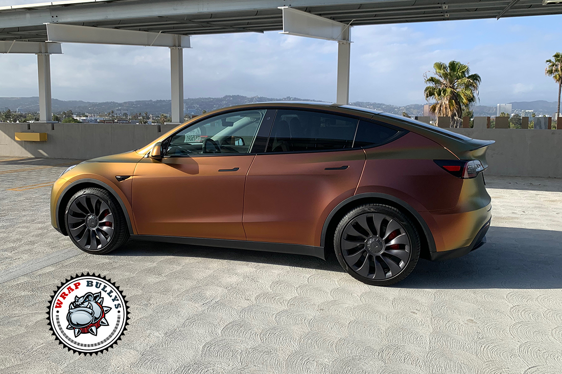 Radiant Revolution: Tesla Model Y Awakens with Avery Satin Rising Sun Red-Gold Vehicle Wrap