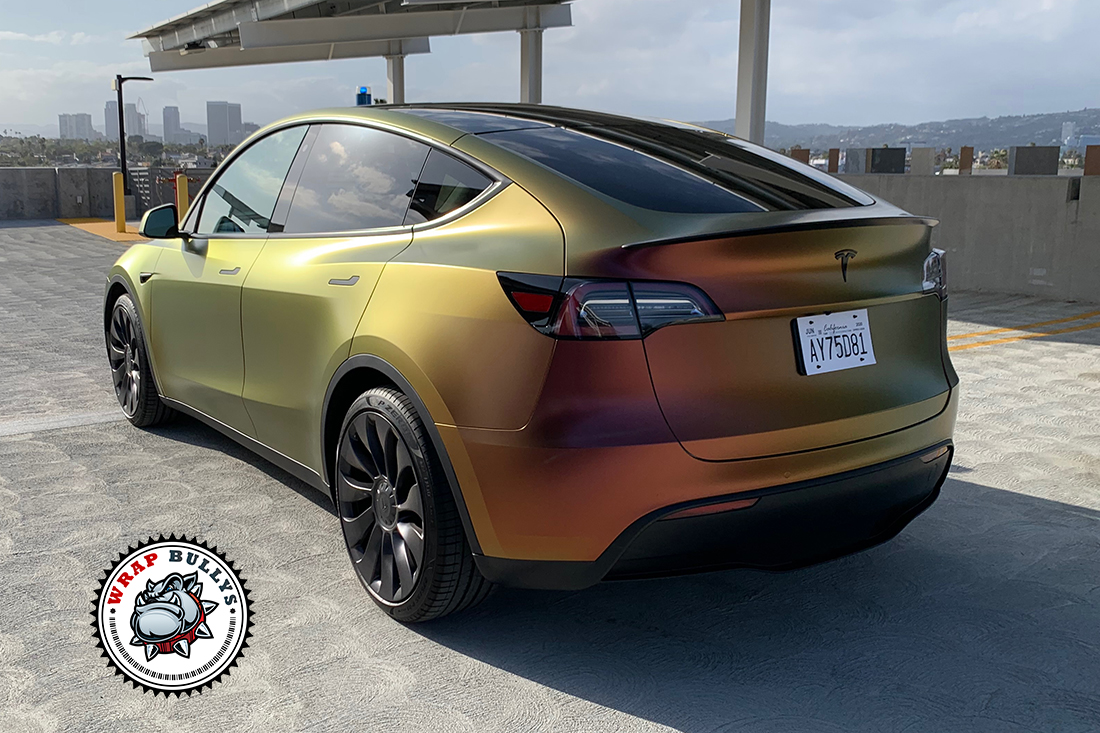 Radiant Revolution: Tesla Model Y Awakens with Avery Satin Rising Sun Red-Gold Vehicle Wrap