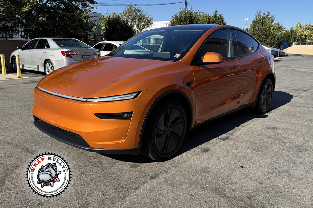 Tesla Model Y Juniper wrapped in 3M Gloss Lucid Copper, front three-quarter view