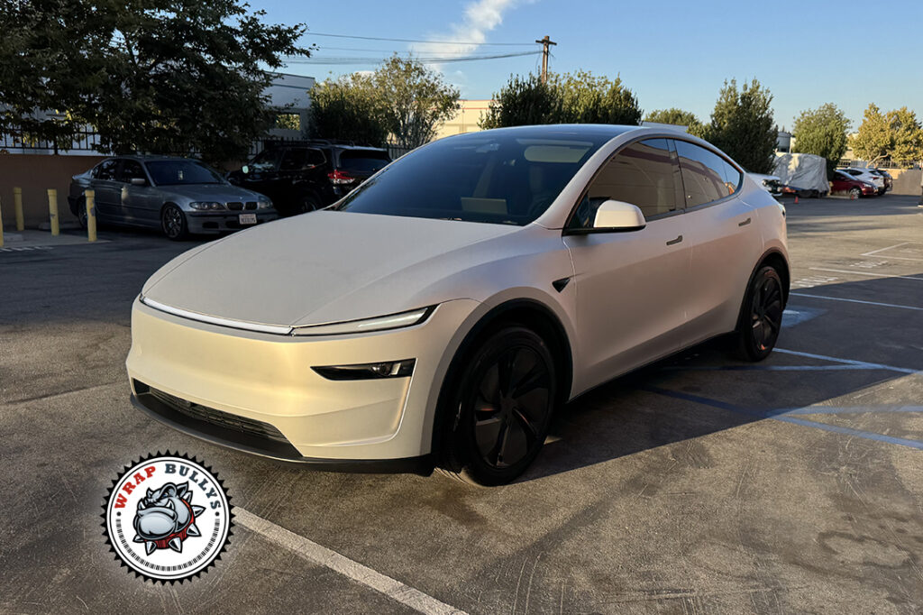 Tesla Model Y Juniper finished in Satin Silver Color PPF, front three-quarter view