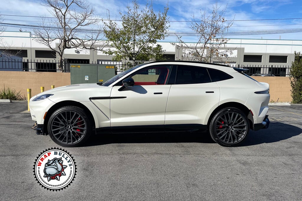 Aston Martin DBX 707 wrapped in 3M Satin Pearl White, rear three-quarter view