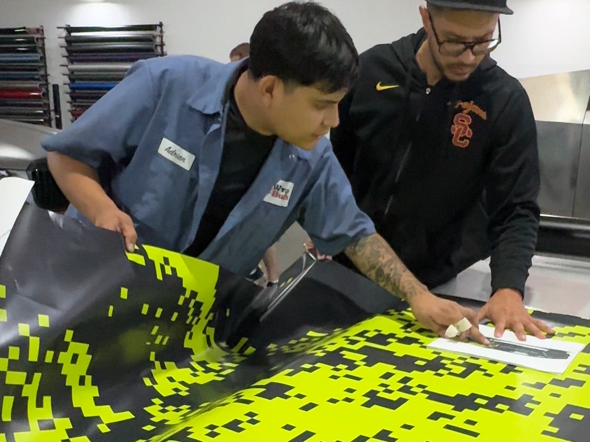 Wrap Bullys team working together on custom printed commercial graphics