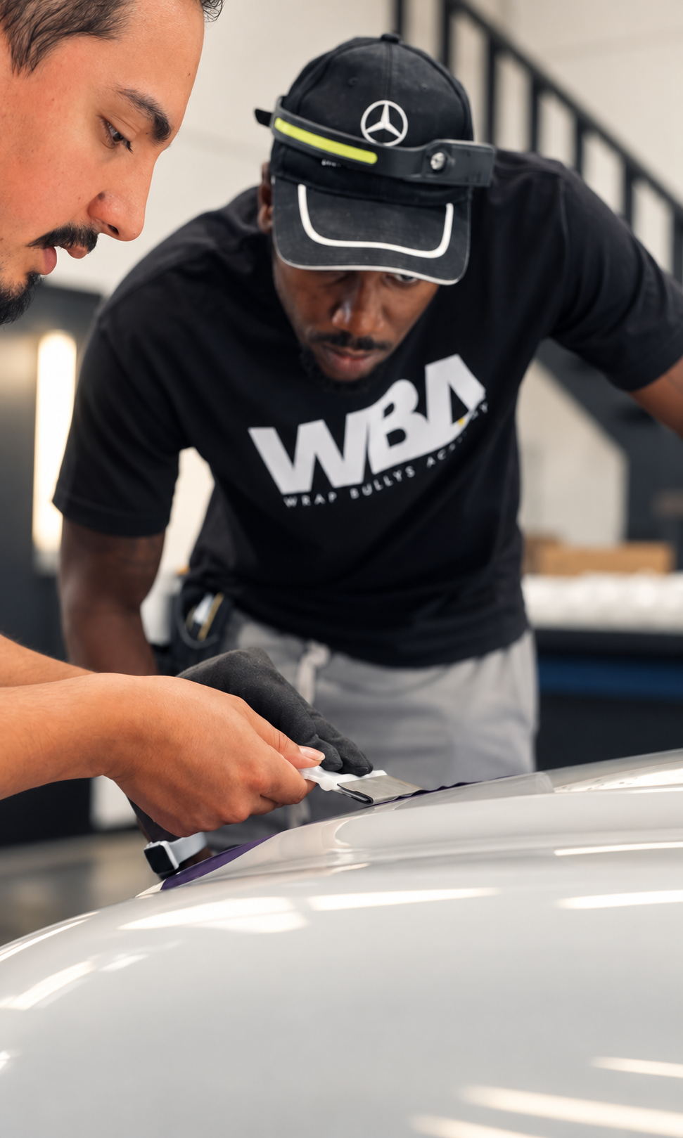 Wrap Bullys Academy student practicing vehicle wrap installation